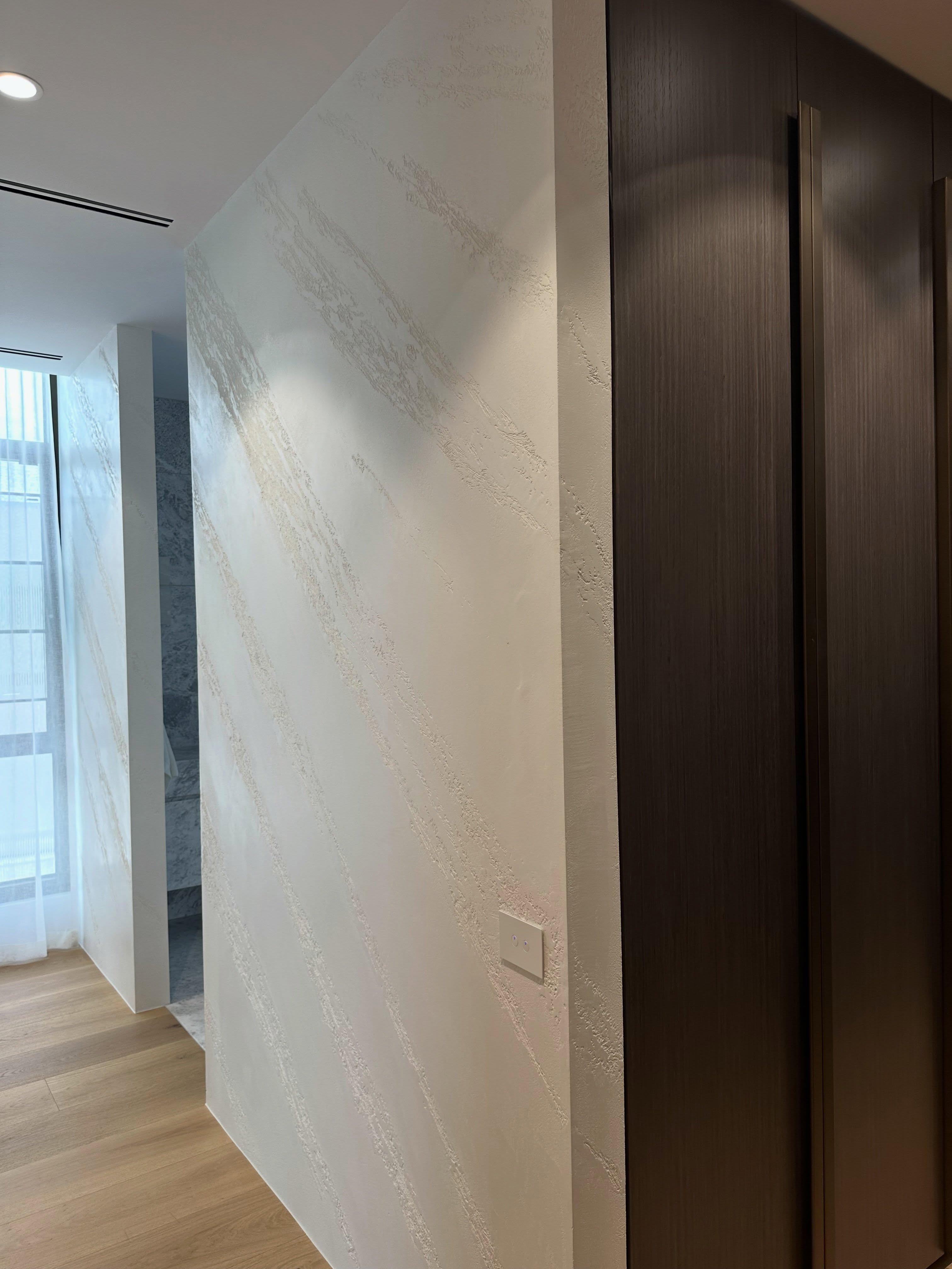 Textured finish through a walk-in wardrobe and hallway